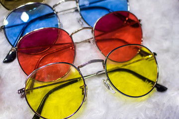 Sunglass shop and different apparel for eyes with colorful accessories and trendy lenses.