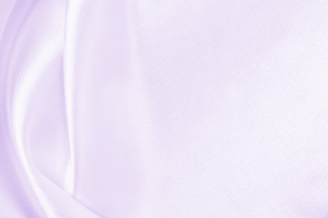 Smooth elegant lilac silk or satin texture as wedding background. Luxurious background design