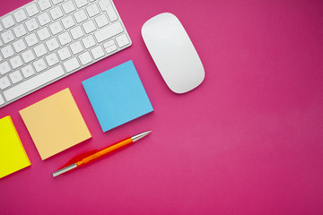 Set of colorful stickers, white keyboard, notebook and snacks. Office table, desk with different...