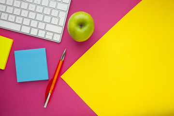 Set of colorful stickers, white keyboard, notebook and snacks. Office table, desk with different objects. Working process. Education, business concept.