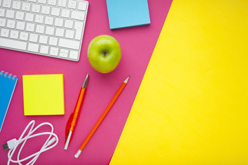 Set of colorful stickers, white keyboard, notebook and snacks. Office table, desk with different objects. Working process. Education, business concept.