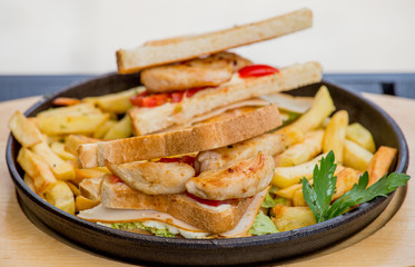 Chicken sandwich in toast bread, with French fries as a bowl, on a white background, restaurant, served