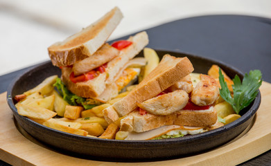 Chicken sandwich in toast bread, with French fries as a bowl, on a white background, restaurant, served