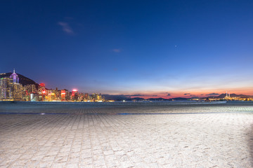 city skyline with empty floor in urban square