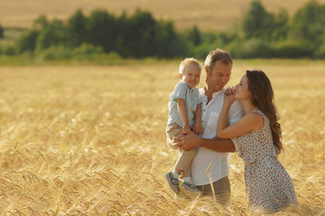 Parents happiness, walking on the field with child