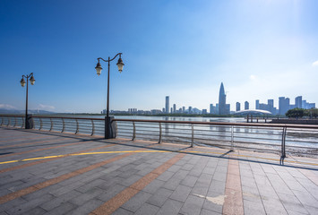 city skyline with empty floor in urban square