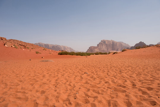 Red sand dunes and sandstone cliffs © salajean