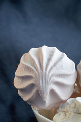 Obraz premium white and pink zephyr close-up on a white plate