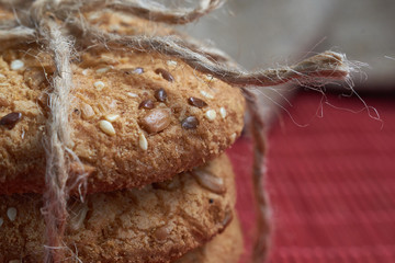 Vegan crunchy cookies with sunflower, flax seeds and sesame seeds isolated. Macro view