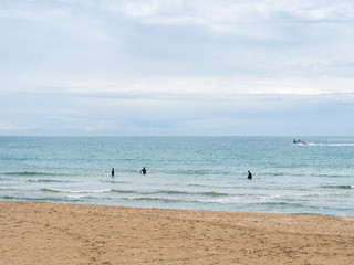 Fototapeta na wymiar surfers waiting for a wave to catch