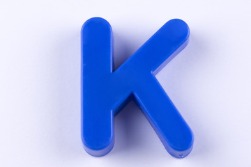 letter K uppercase alphabet isolated made of plastic on white background with shadows