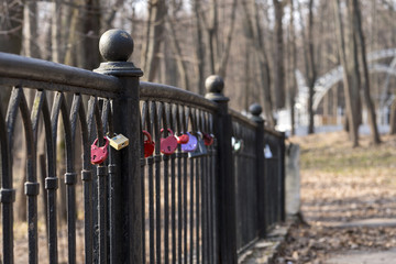 lock on the fence on the bridge as a symbol of love. The key is thrown into the lake.