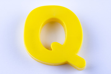 letter Q uppercase alphabet isolated made of plastic on white background with shadows