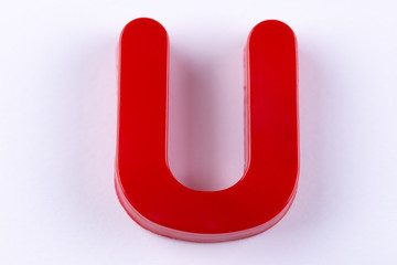 letter U uppercase alphabet isolated made of plastic on white background with shadows