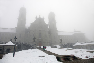 View of Monastery in Einsiedeln in a fog