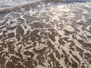 mare schiuma tramonto