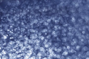 abstract blue bokeh glitter sparkle background.