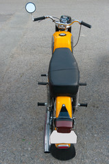 Old, fully functional motorcycle. This bike was manufactured in the twentieth century.