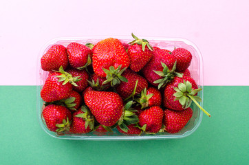 Plastic container with fresh strawberries