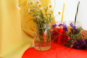 Summer concept with bright cocktails, fresh strawberry and camomile on red  bright background. Close up