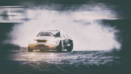 Car drifting, Blurred of image diffusion race drift car with lots of smoke from burning tires on speed track © applezoomzoom