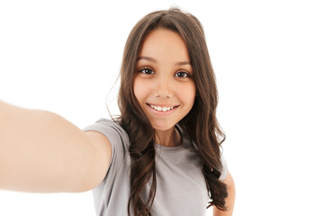 Pretty cute girl make selfie looking camera.