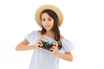 Girl tourist photographer isolated over white wall
