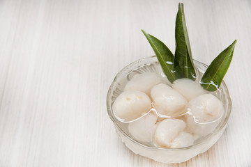 Lychee casing in the cup and fruit.