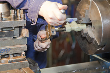 metal turner work on a universal lathe