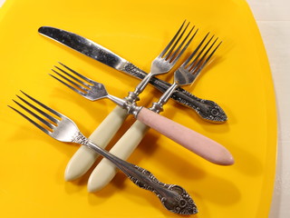 several table forks on the table