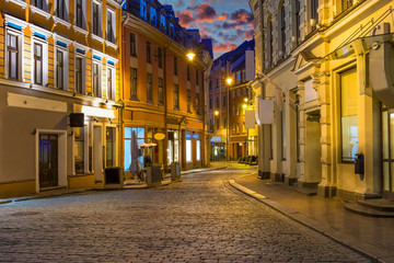 Fototapeta na wymiar Early morning in historical center of Riga - – the capital of Latvia and famous among tourists Baltic city with unique medieval and Gothis architecture