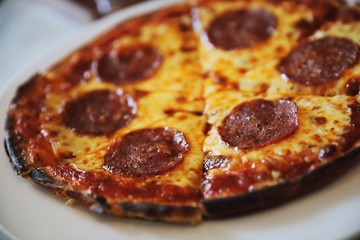 pepperoni pizza on dish , italian food