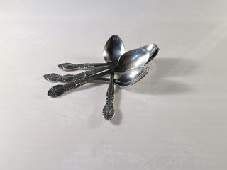 a few teaspoons on the table