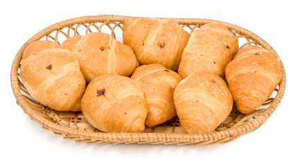 Croissants in basket with chocolate cream on white background isolated