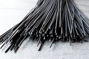 Raw Black Spaghetti Pasta Flavored with Squid ink or Cuttlefish.
