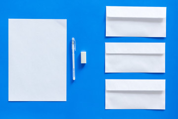 Mockup template for branding identity. White stationery on blue background top view. Pattern
