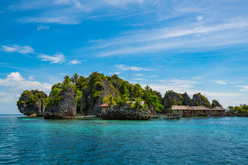 Naklejka na ściany i meble East Misool, group of small island in shallow blue lagoon water, Raja Ampat, West Papua, Indonesia