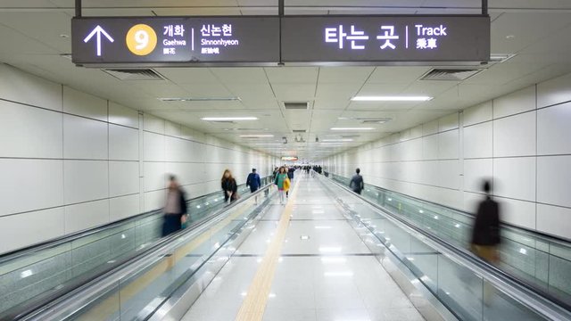 Commuters on an escalator in Seoul's Subway System, Seoul, South Korea, Asia