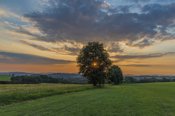 Fototapeta na wymiar Color sunset near Roprachtice village