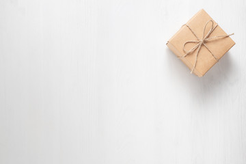 gift box tied with string on a white background