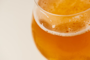 Glass of beer on white background