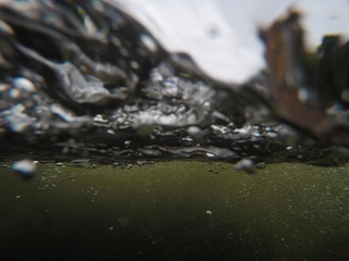 air bubble underwater brown waterfall (gopro style) background