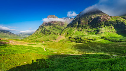 Beautiful sunrise and tiny shadow of man, Glencoe, Scotland © shaiith