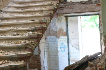 destroyed stairs and light entrance