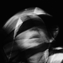 Scream of horror. Screaming woman face. Shot with long exposure.