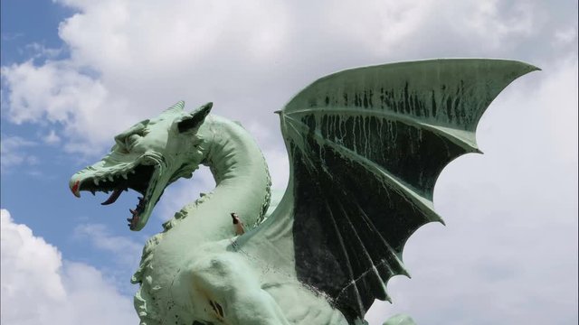 Time lapse behind Dragon statue on The Dragon Bridge