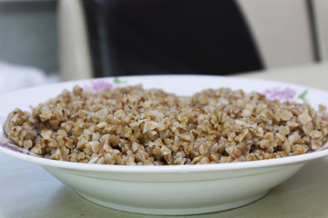 Buckwheat porridge in a ceramic plate