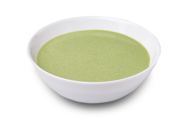 Cream soup green from spinach in a bowl  isolated on white background