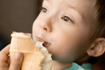 boy eating ice cream. harm sweet for children
