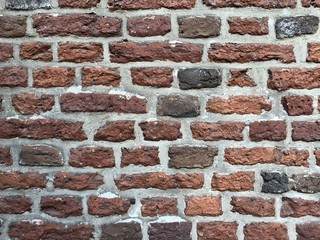 old dilapidated red brick wall